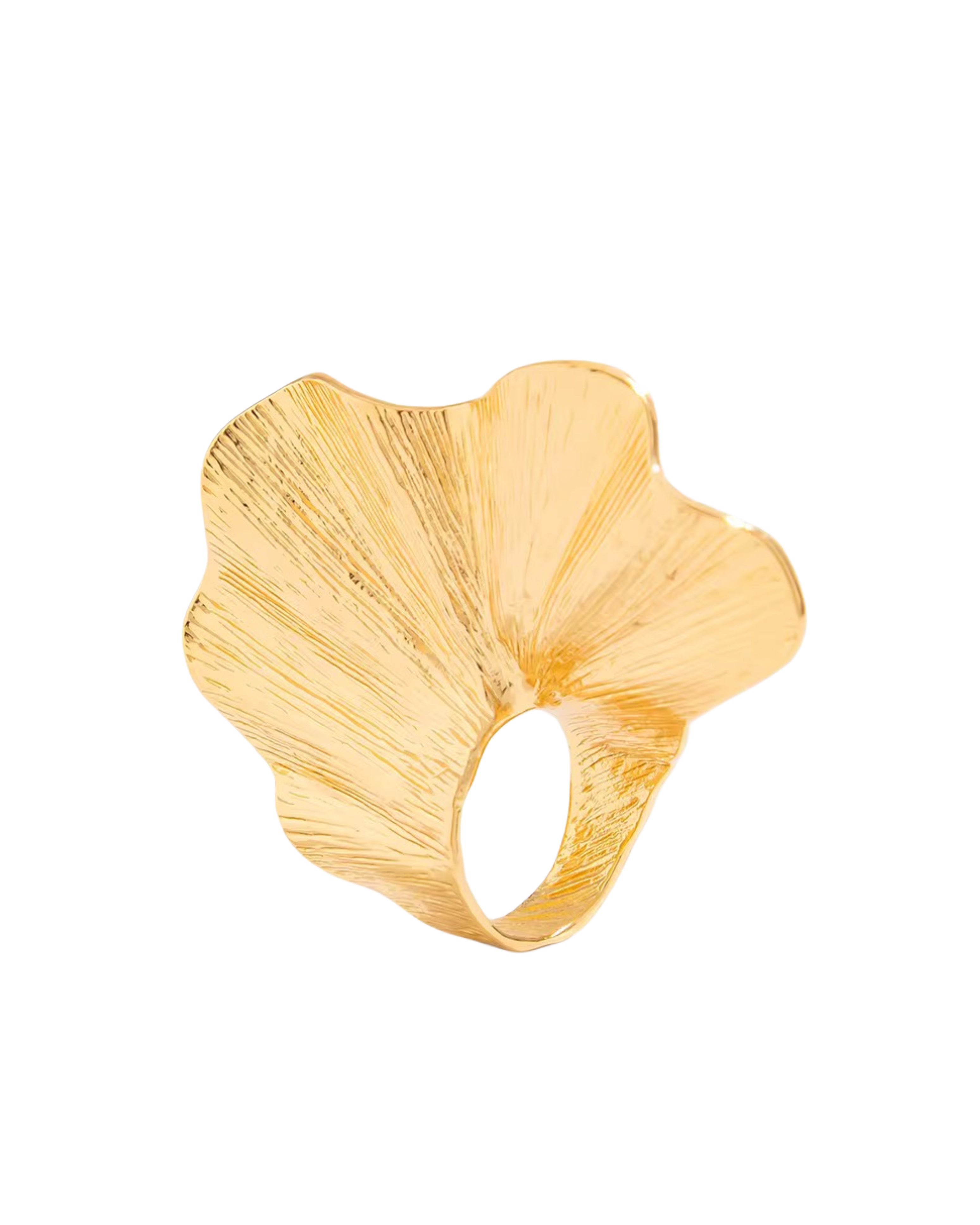 Gold edith ring with a leaf-like design on a white background