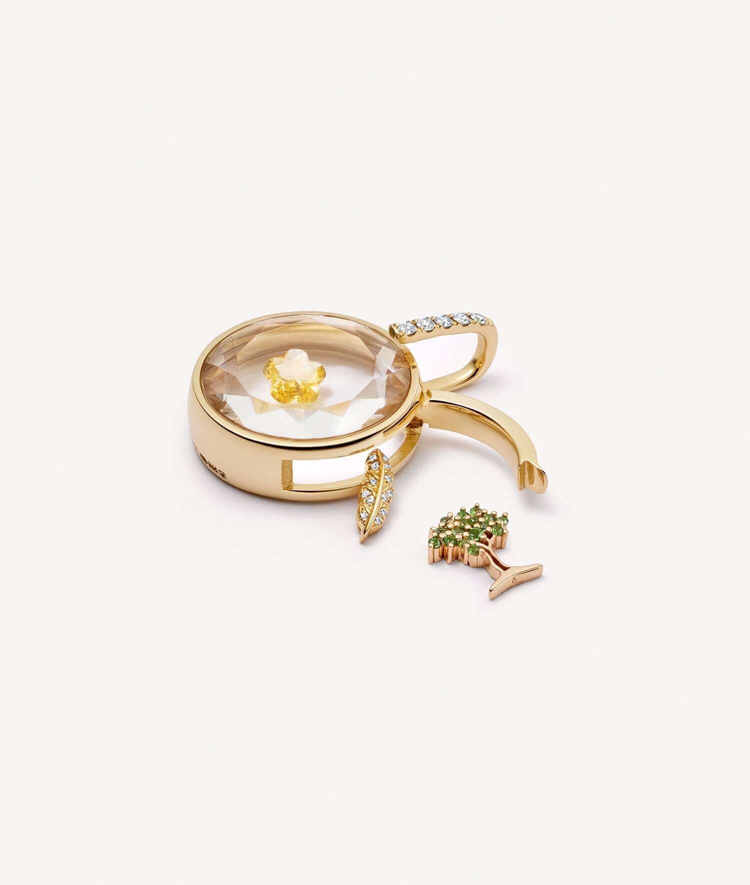 Gold ring with decorative elements on a white background