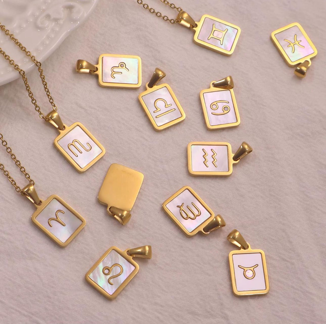 SHELL ZODIAC CHARM