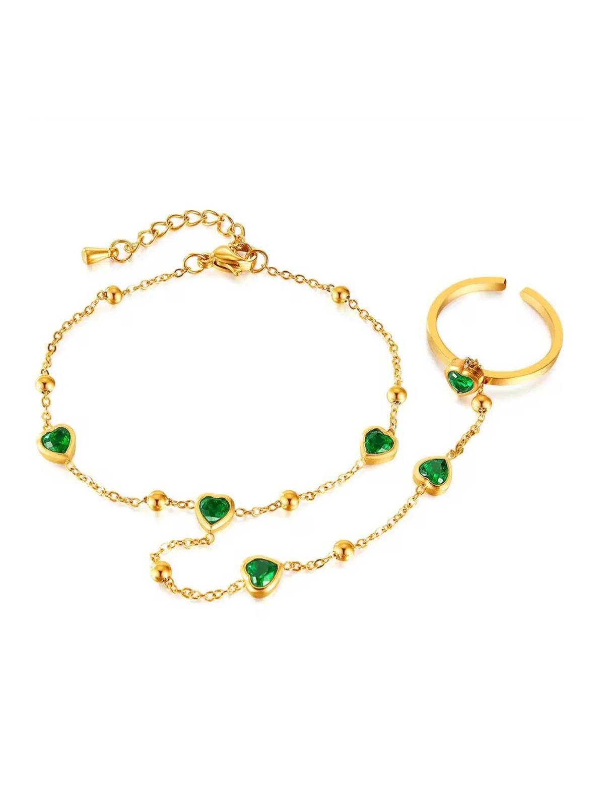 An 18k gold plated lenore bracelet with green accents, designed for the hand.