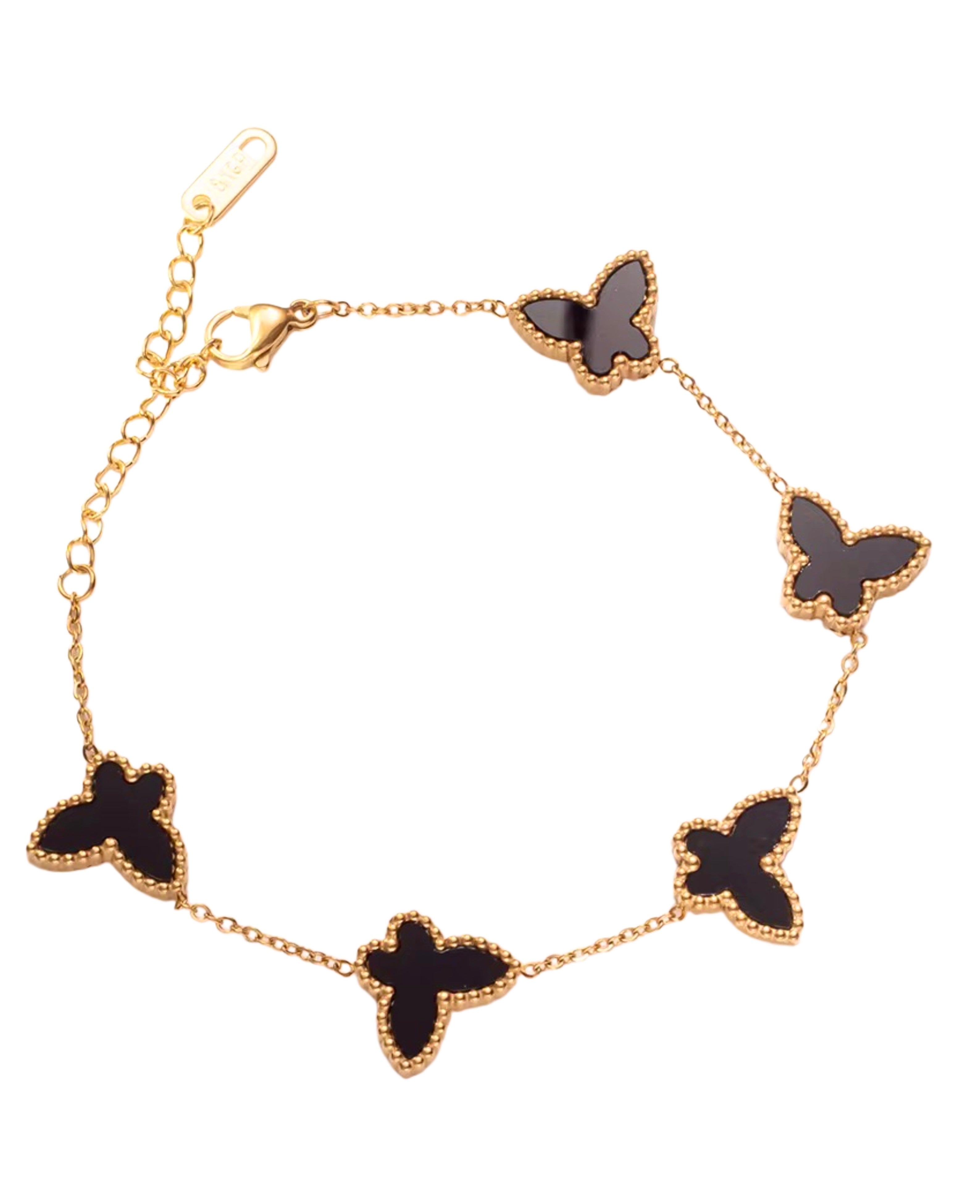 Bracelet with black butterfly-shaped charms on a gold chain against a white background