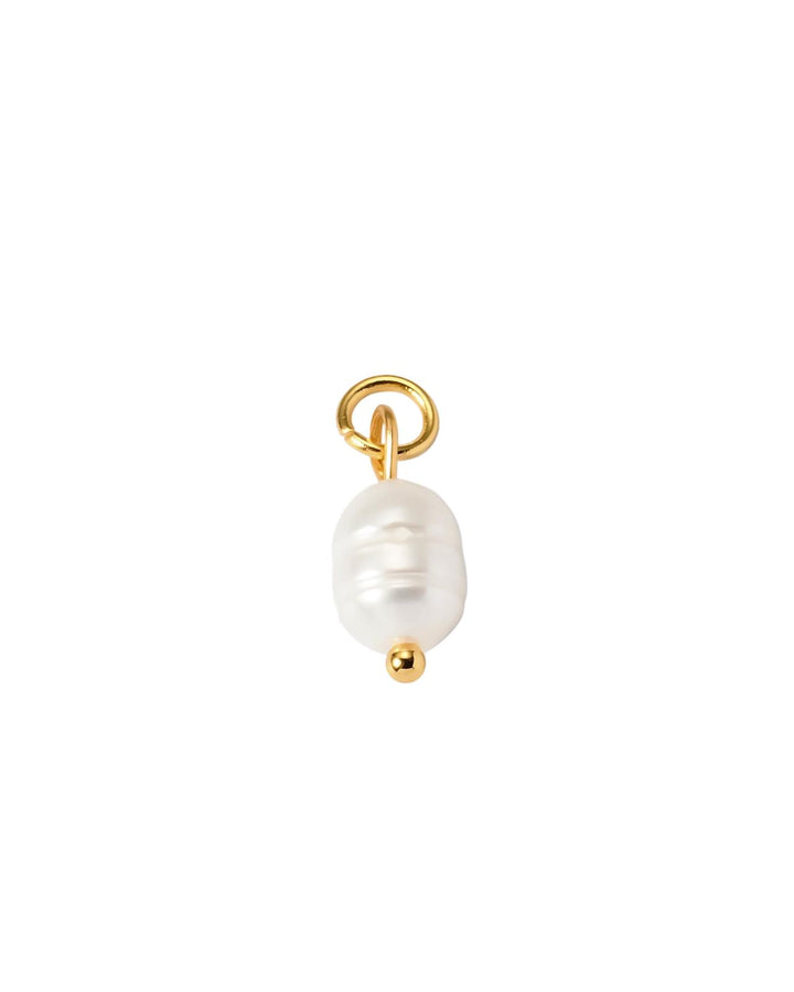 Pearl charm with gold ring on a white background