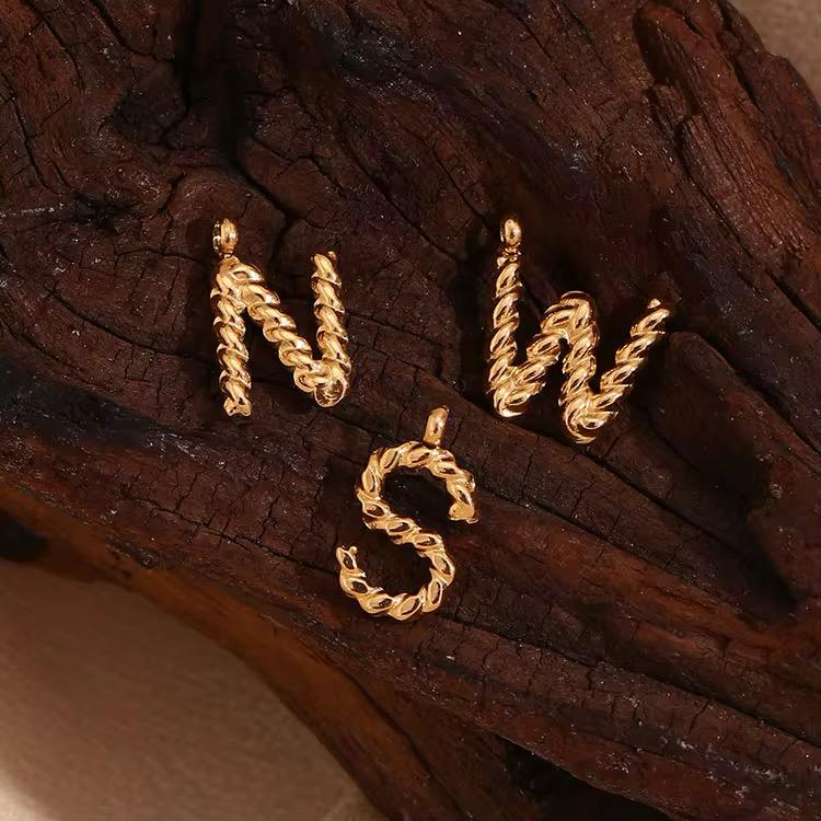 TWISTED LETTER CHARM