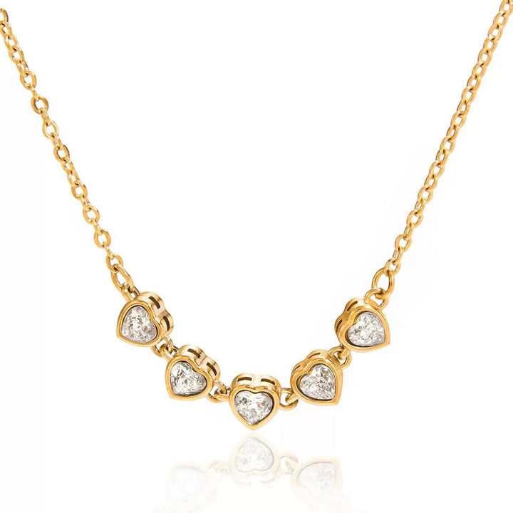 Gold necklace with heart-shaped pendants for her