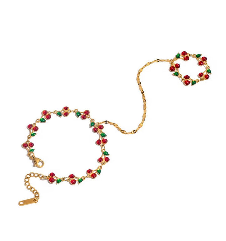 Gold bracelet with red and green beads for her
