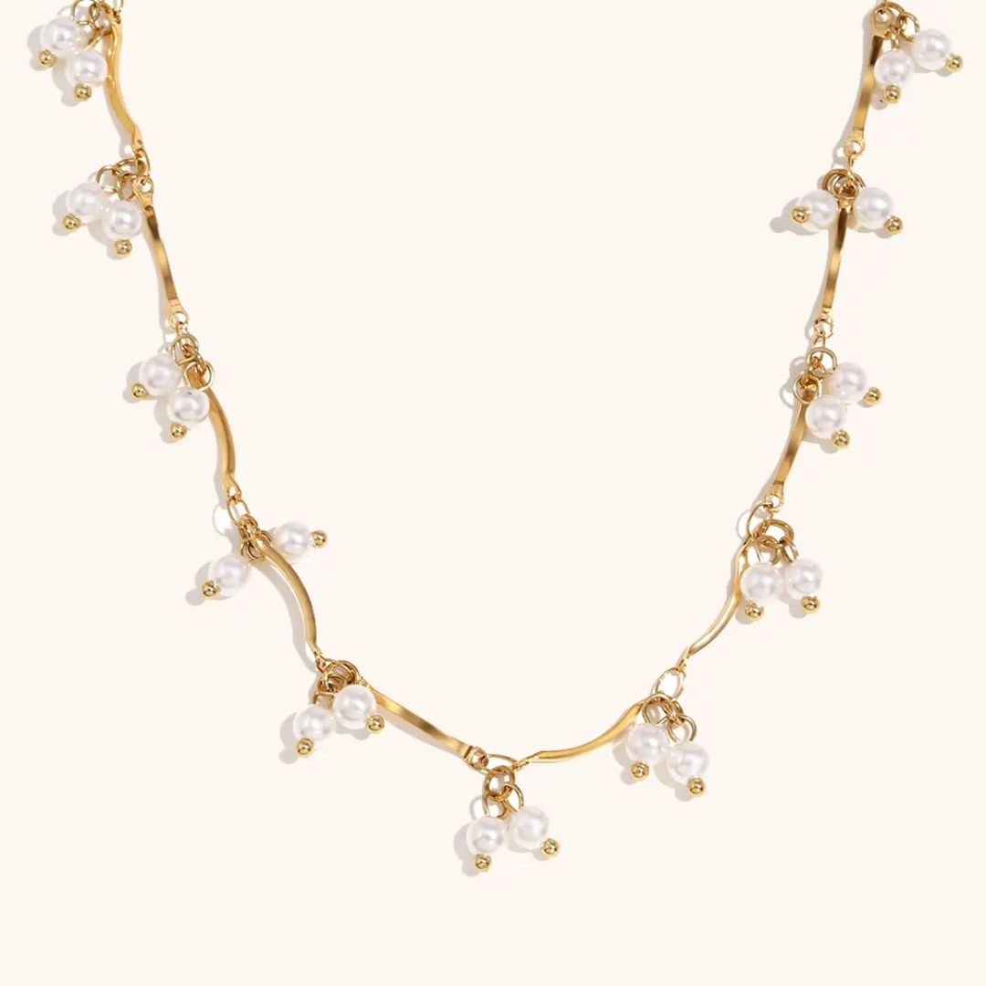 Gold necklace with pearls for her
