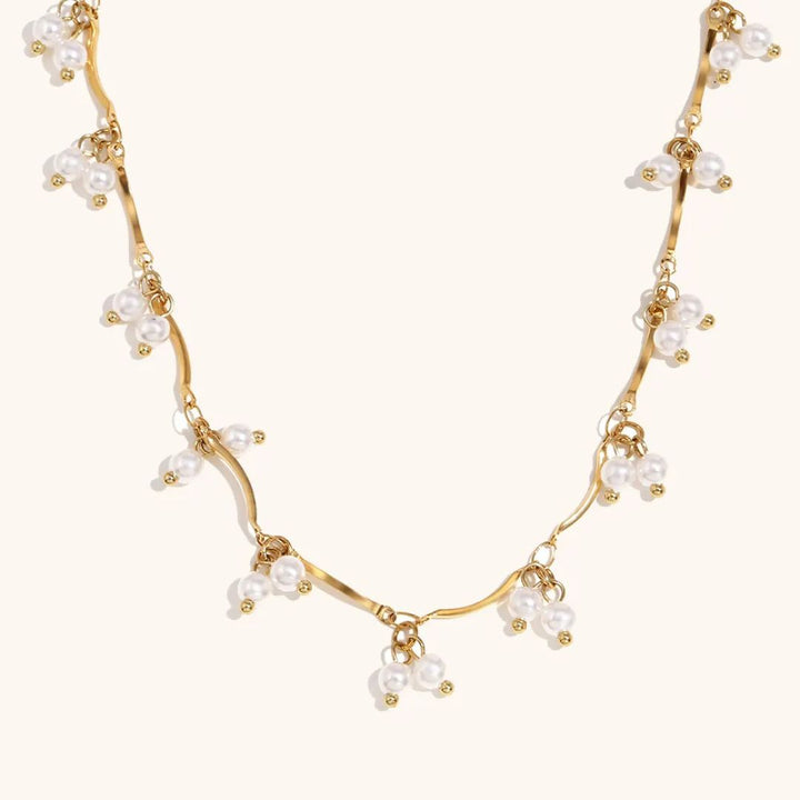 Gold necklace with pearls for her
