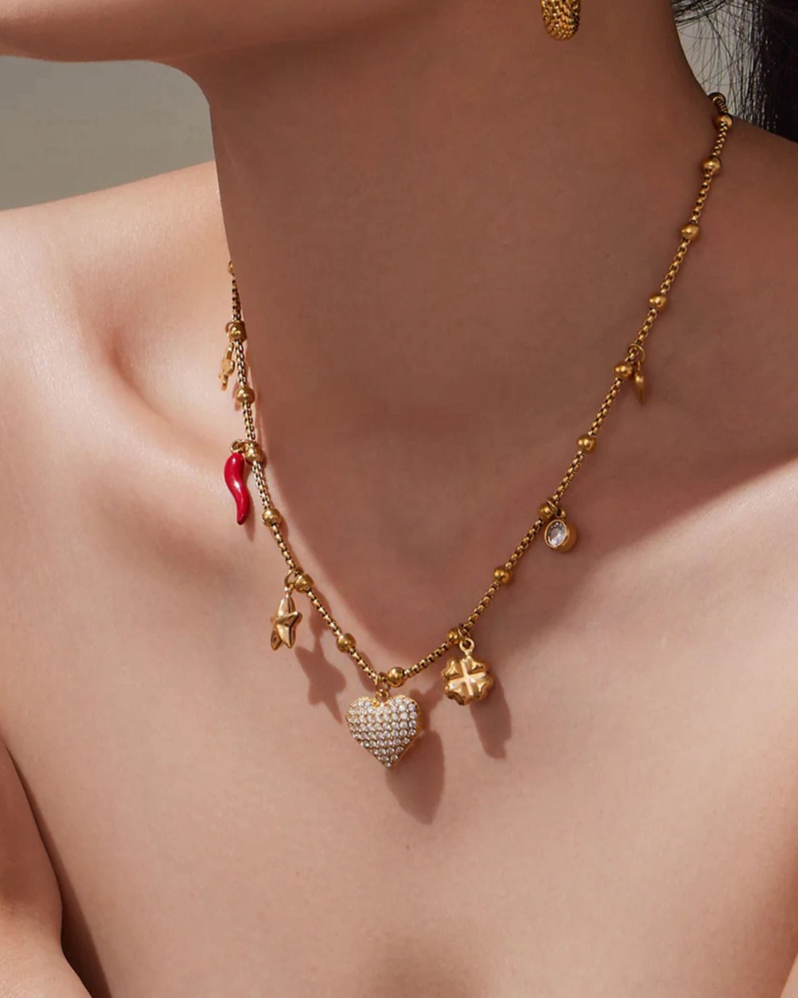 Trendy gold necklace with charms for her