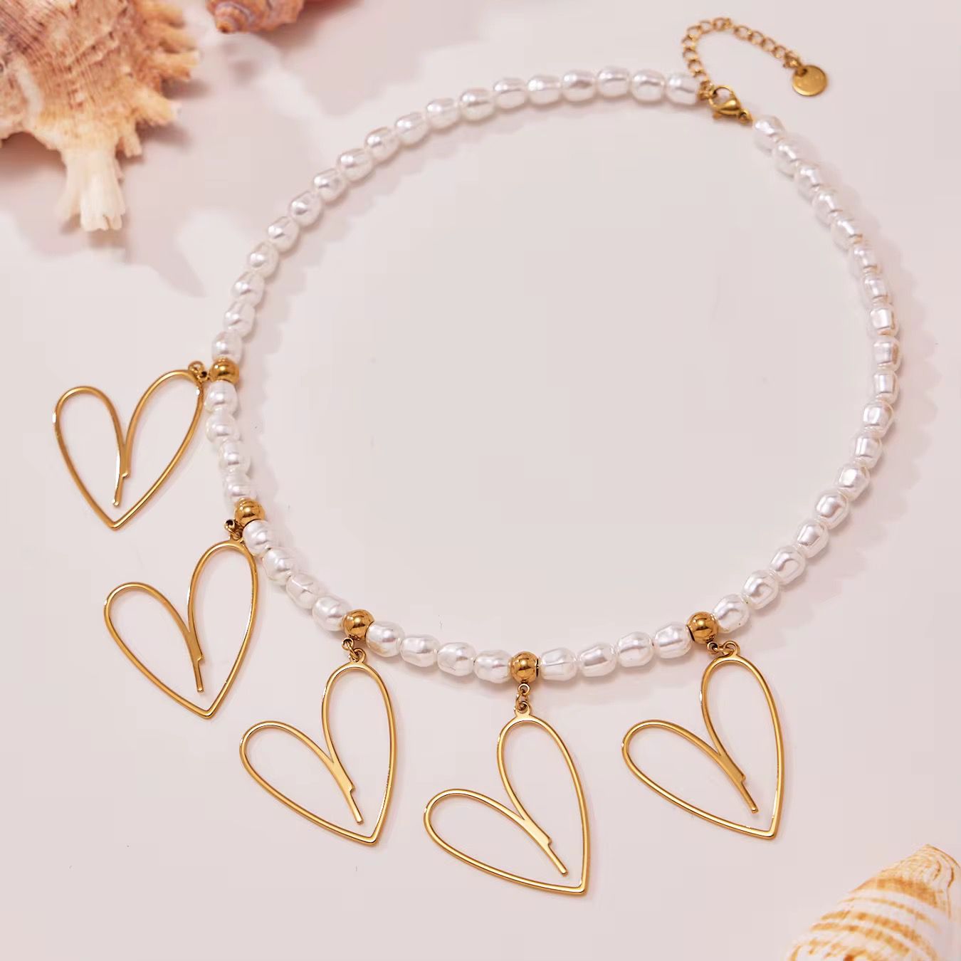 Gold pearl necklace with heart for her