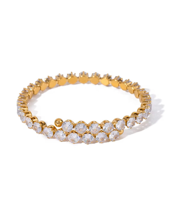 Gold and diamond bracelet on a white background
