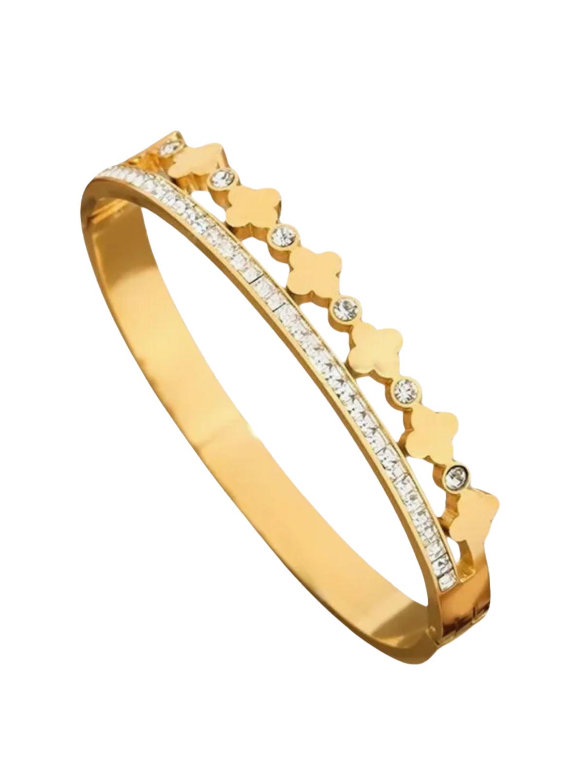 A gold-plated stainless steel zirconia clover bangle featuring a clover pattern with cubic zirconia inlays, displayed against a white background.