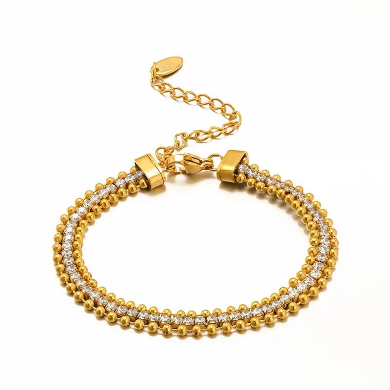 A two-tone (gold and silver) dita bracelet with a chain design, featuring a clasp for closure.
