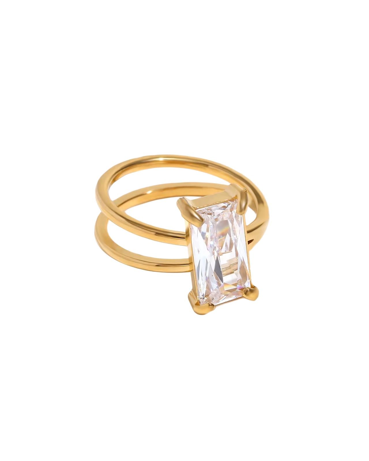 Gold freesia ring with a rectangular diamond on a white background