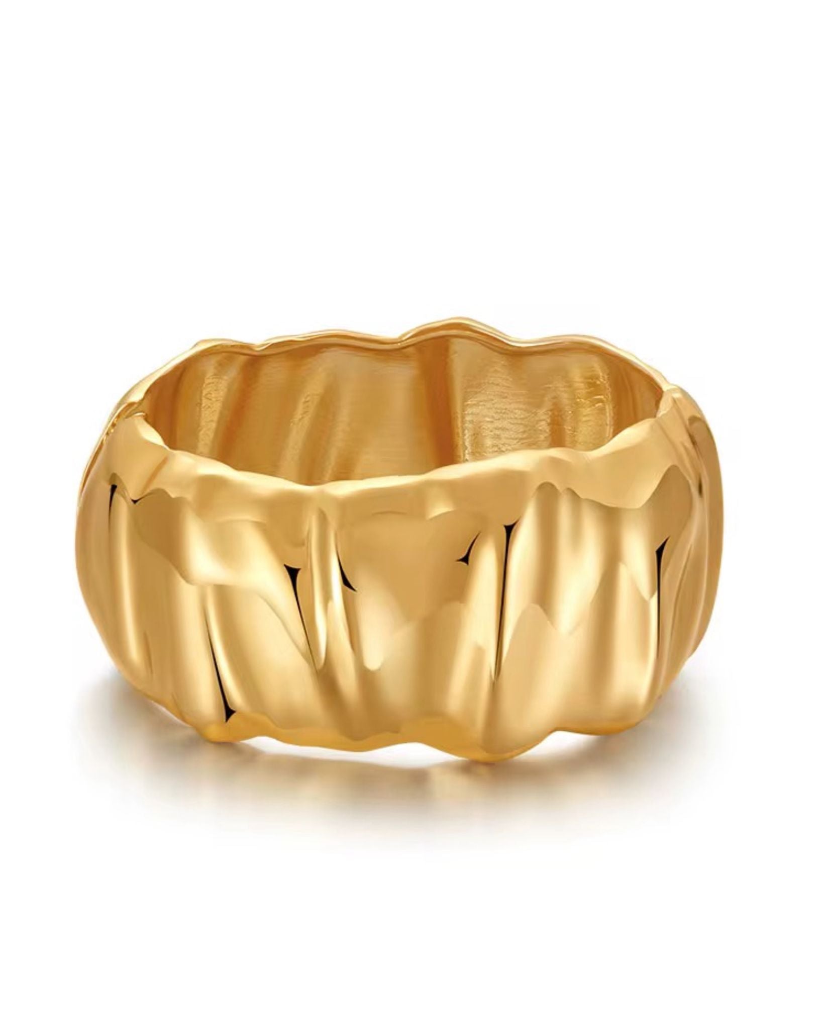 Gold gloria heart ring with a textured design on a white background