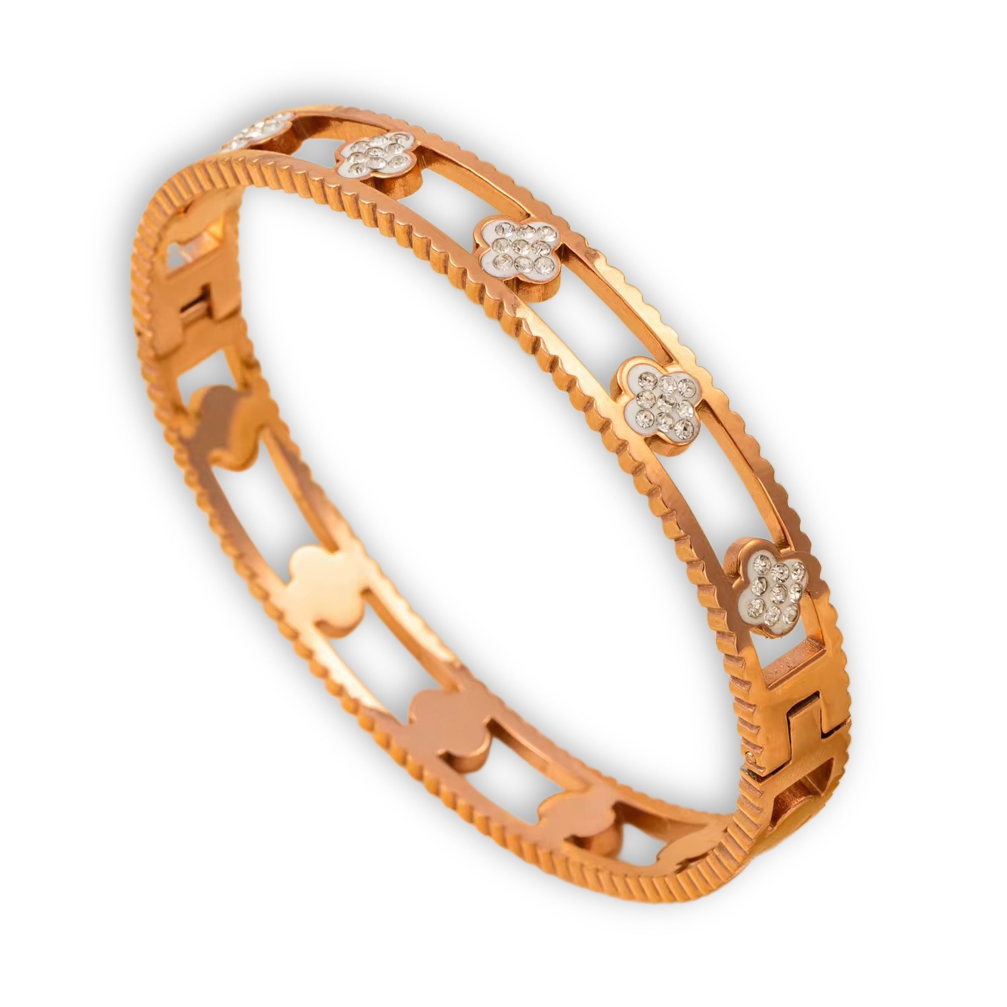 An 18k gold plated stainless steel huda bangle with a pattern of hearts and flowers, adorned with small diamonds, displayed against a white background.