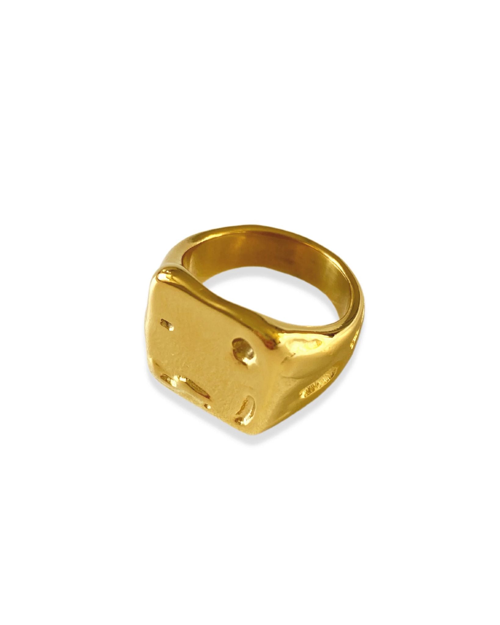 Goldy ring with a unique design on a white background