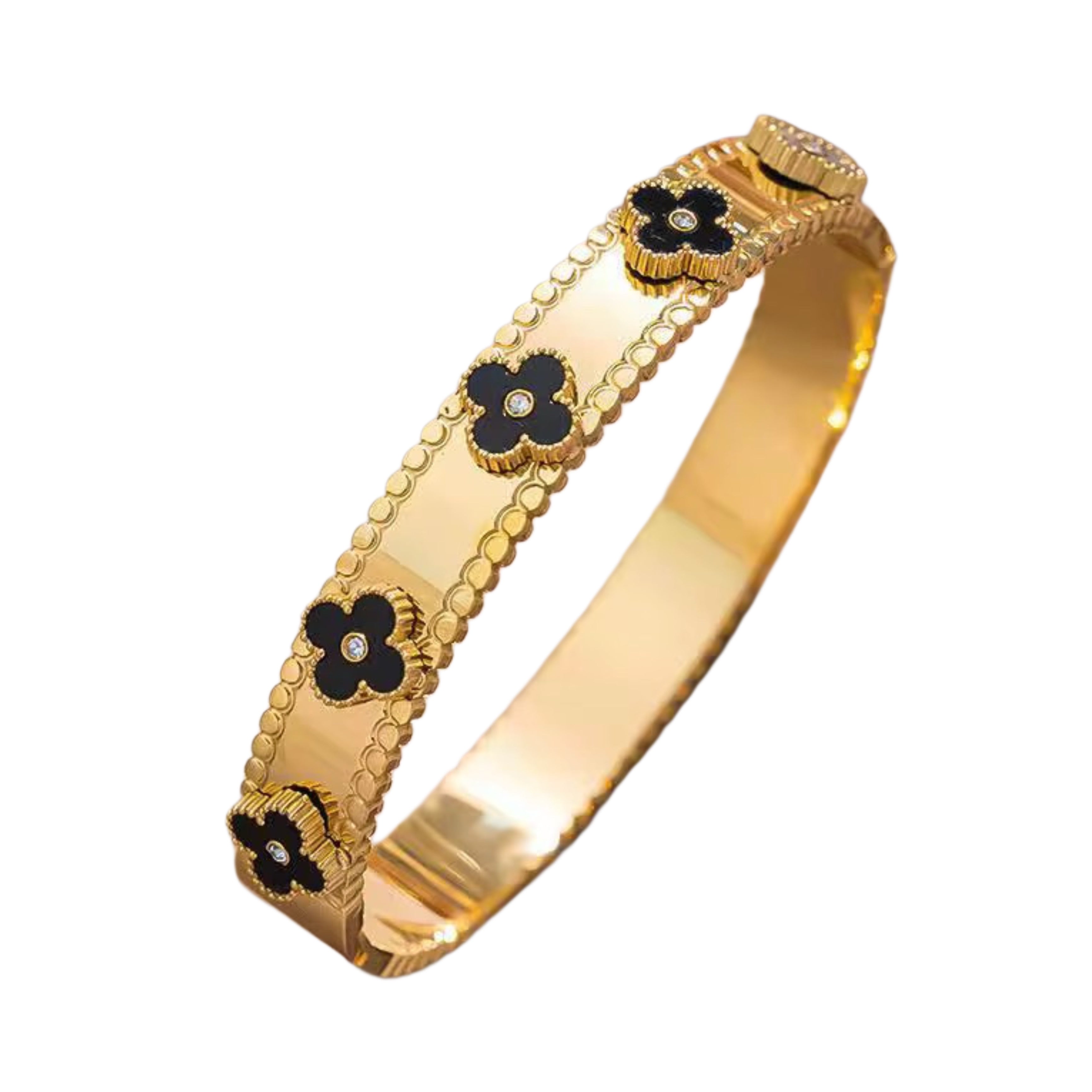 An 18k gold plated stainless steel helen clover bangle bracelet with black and gold clover designs on it.