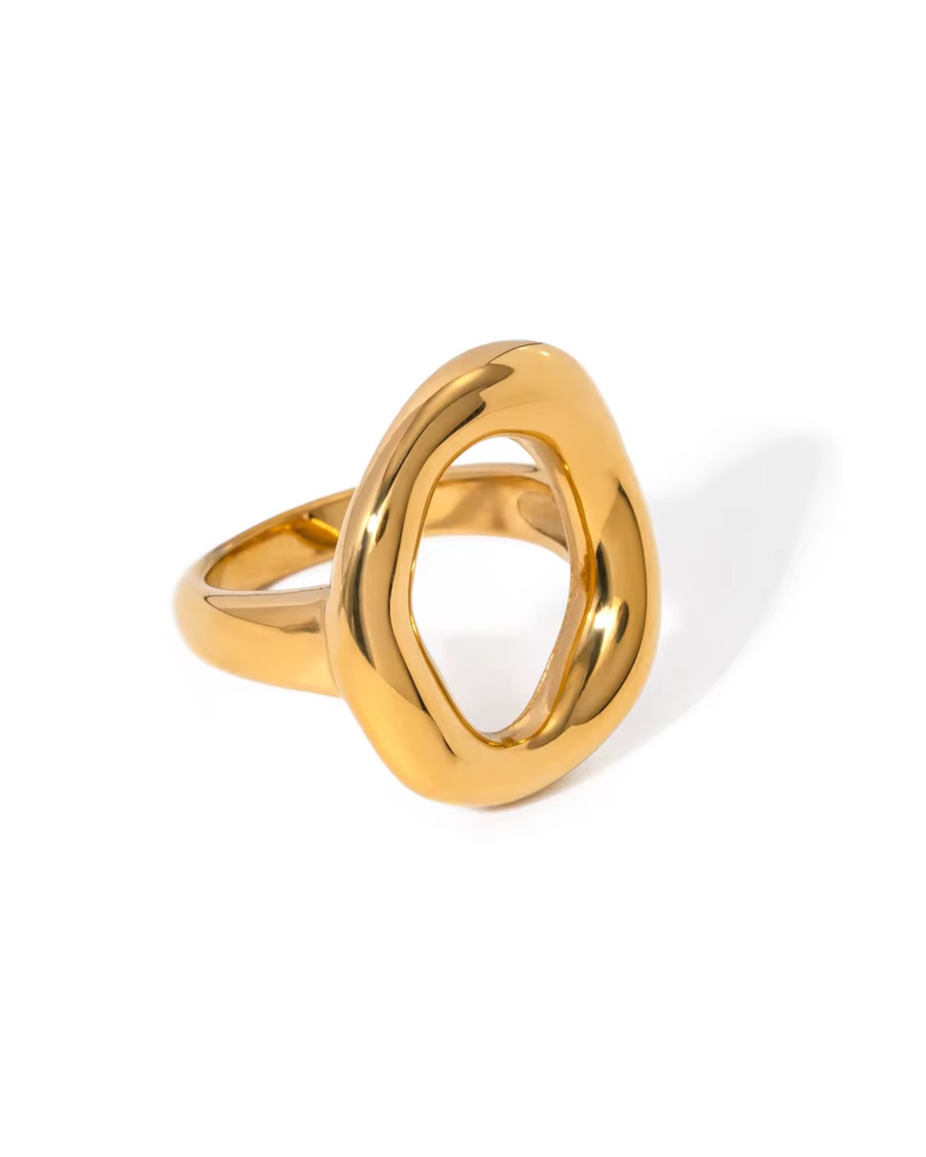 Gold jemma ring with a unique design on a white background