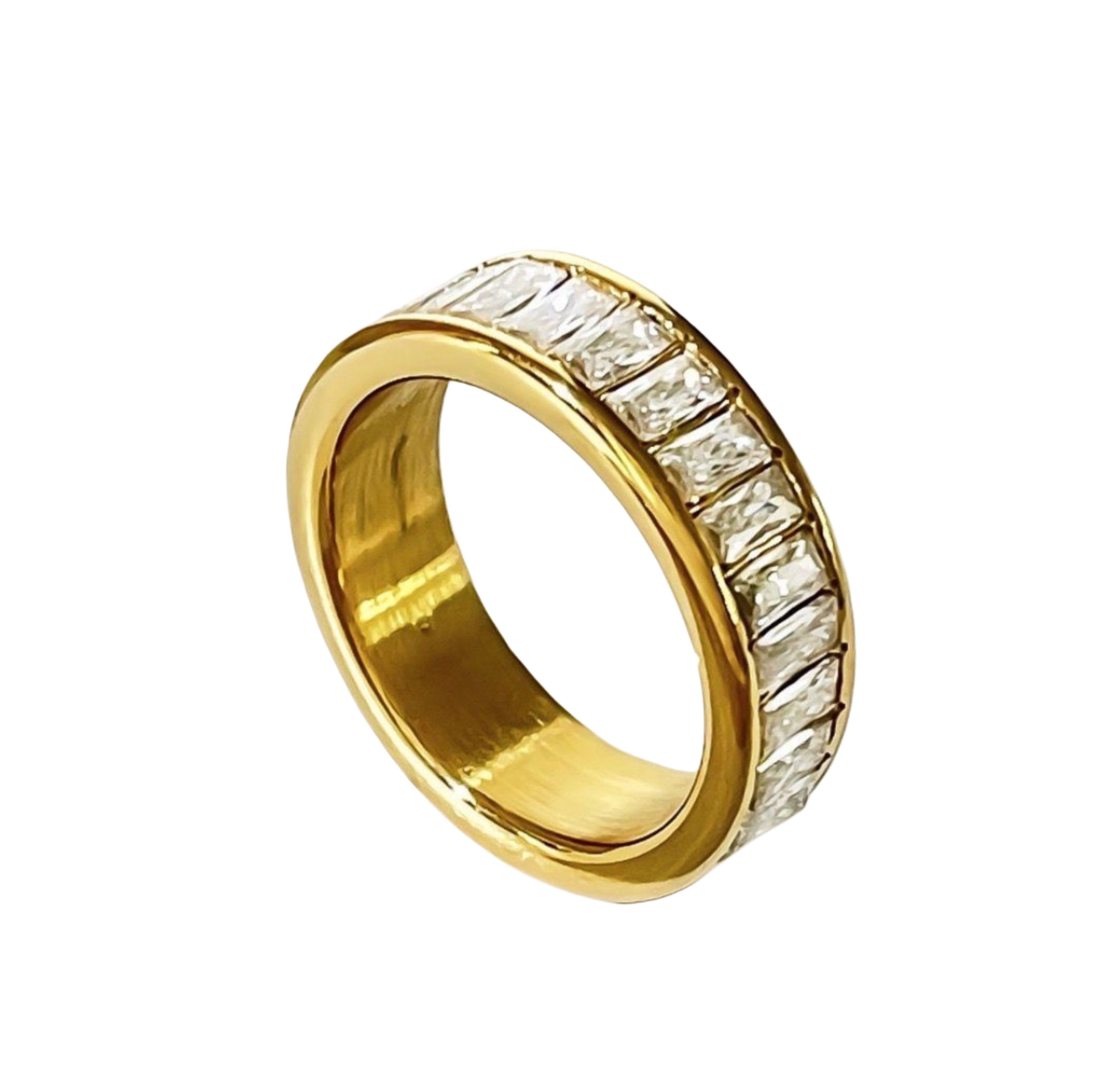 A gold-colored mia gold ring with zirconia stones set in a band, placed on a white background.