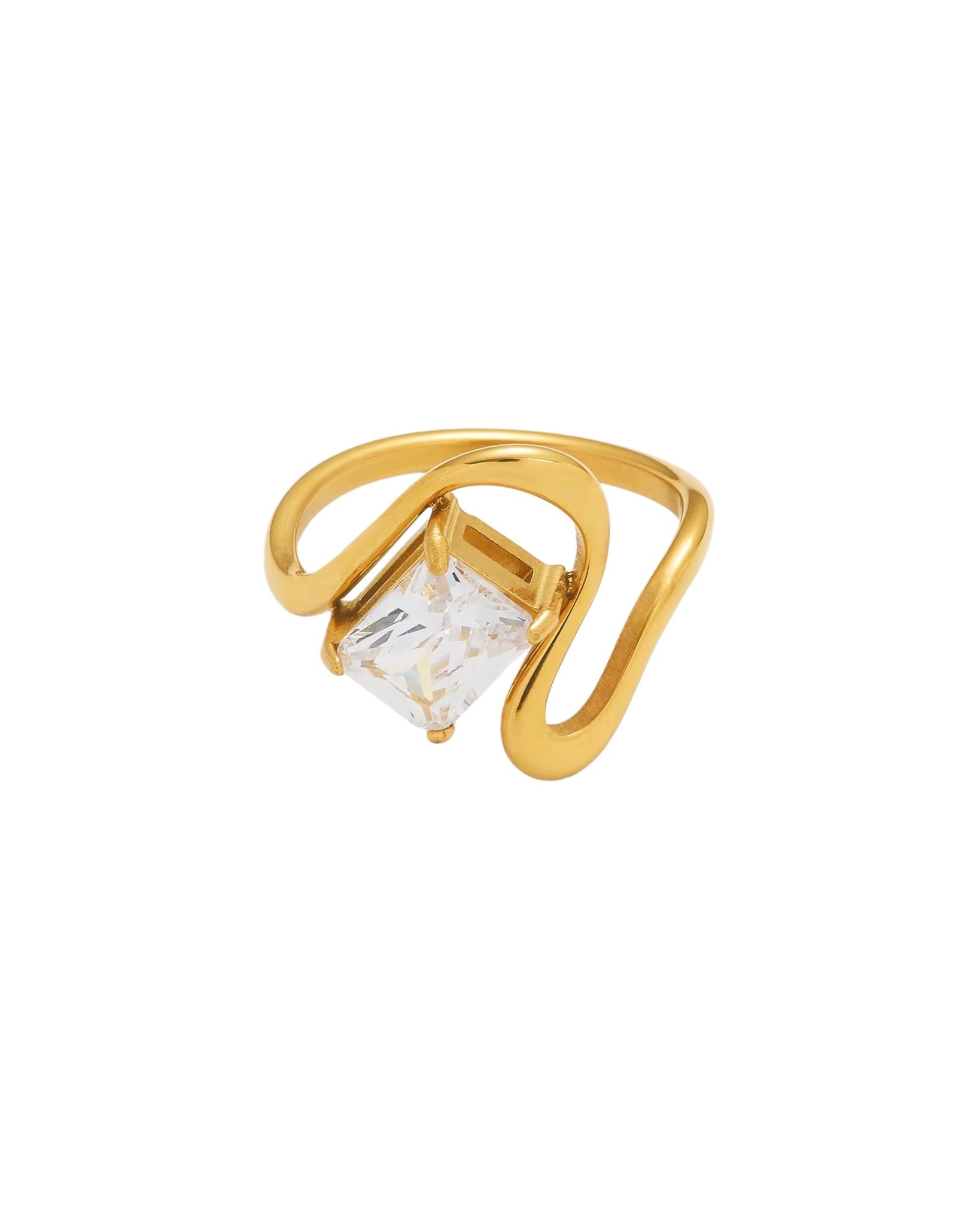 Gold neah ring with a clear gemstone on a white background