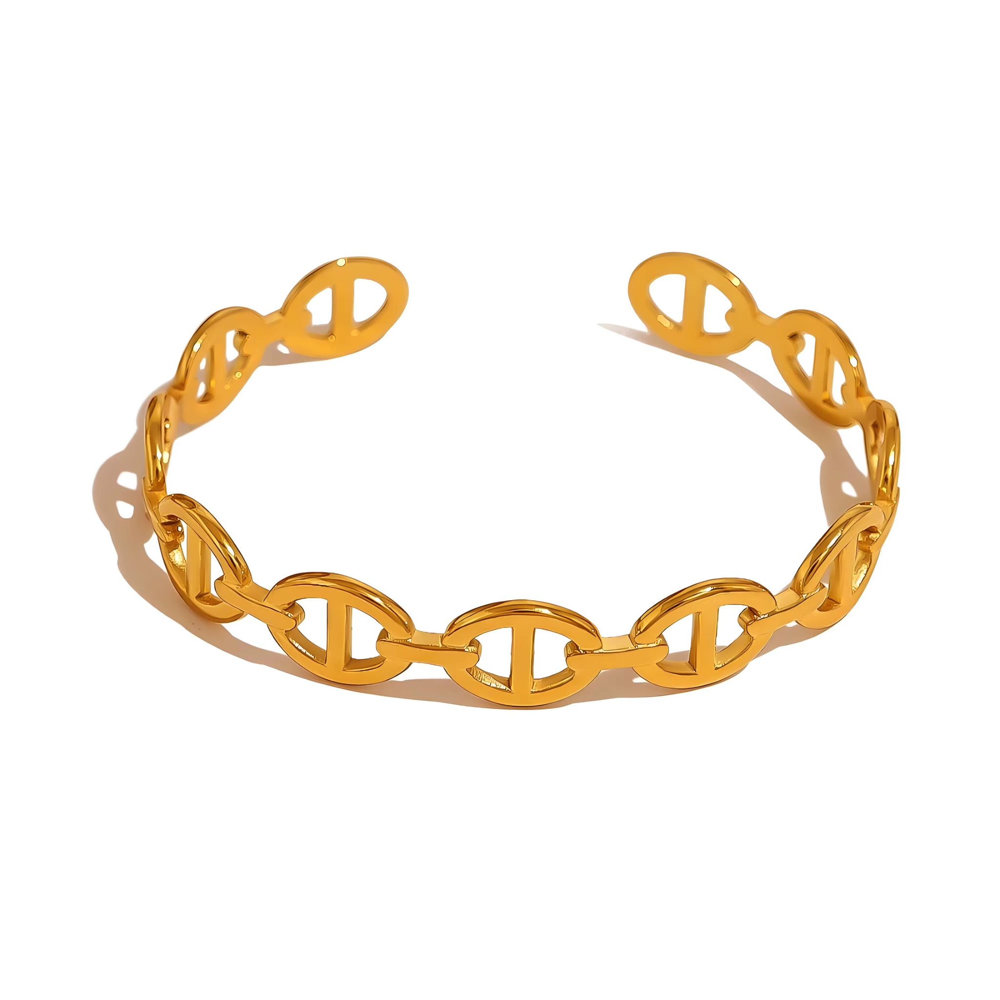 Gold oval chain bracelet with intricate design on a white background