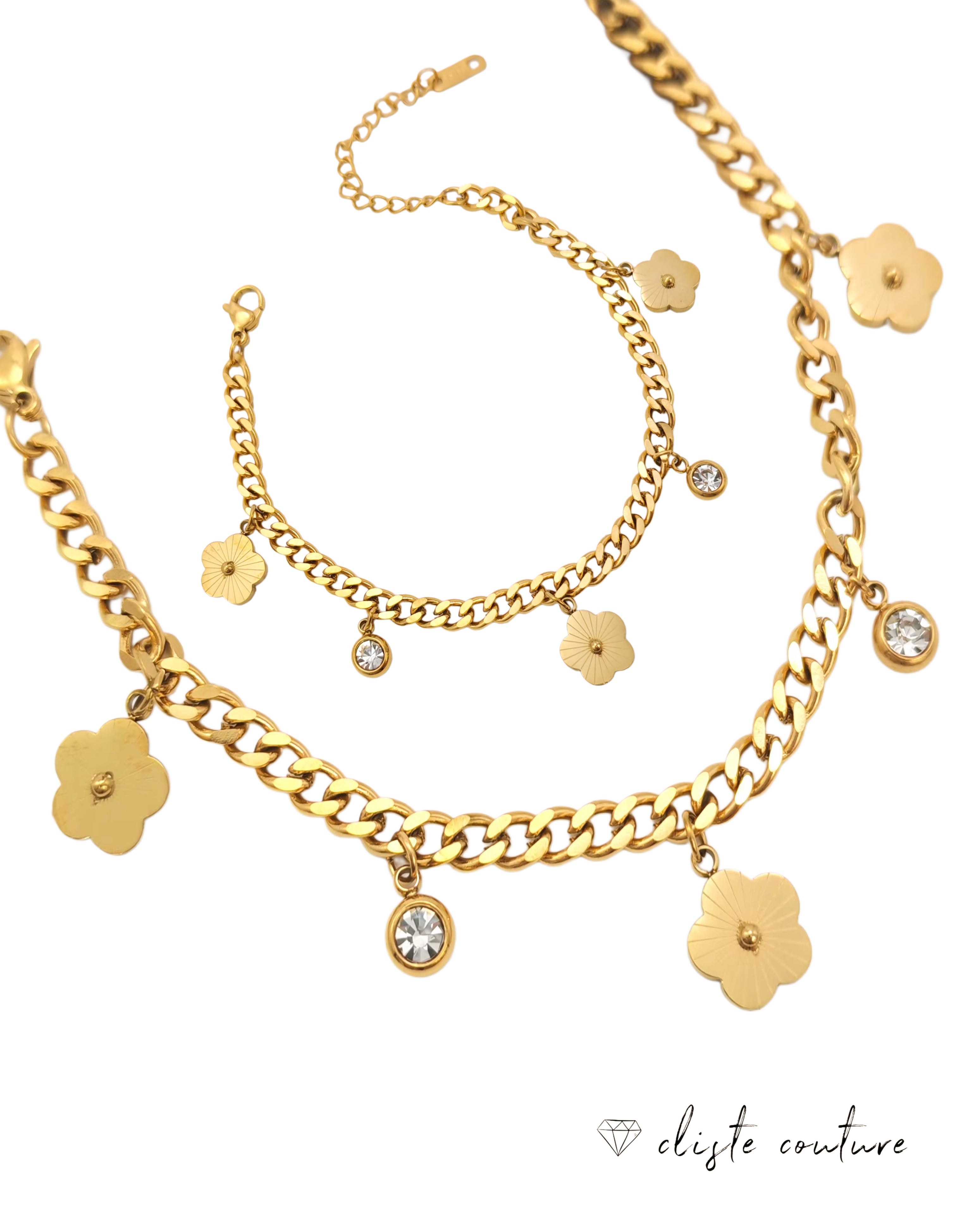 Gold chain roma double chain clover set necklace with floral charms on a white background