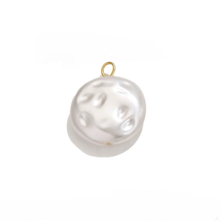 A single pearl charm with an 18k gold PVD plated stainless steel ring attached to its top.