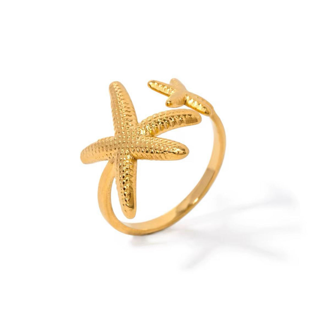 An 18K gold plated stainless steel starfish ring with a starfish design, featuring an adjustable band.