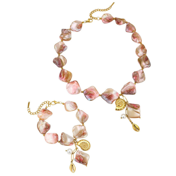 A matching necklace and sun kissed bracelet set with gold plating and natural shell beads, featuring a sun motif charm.