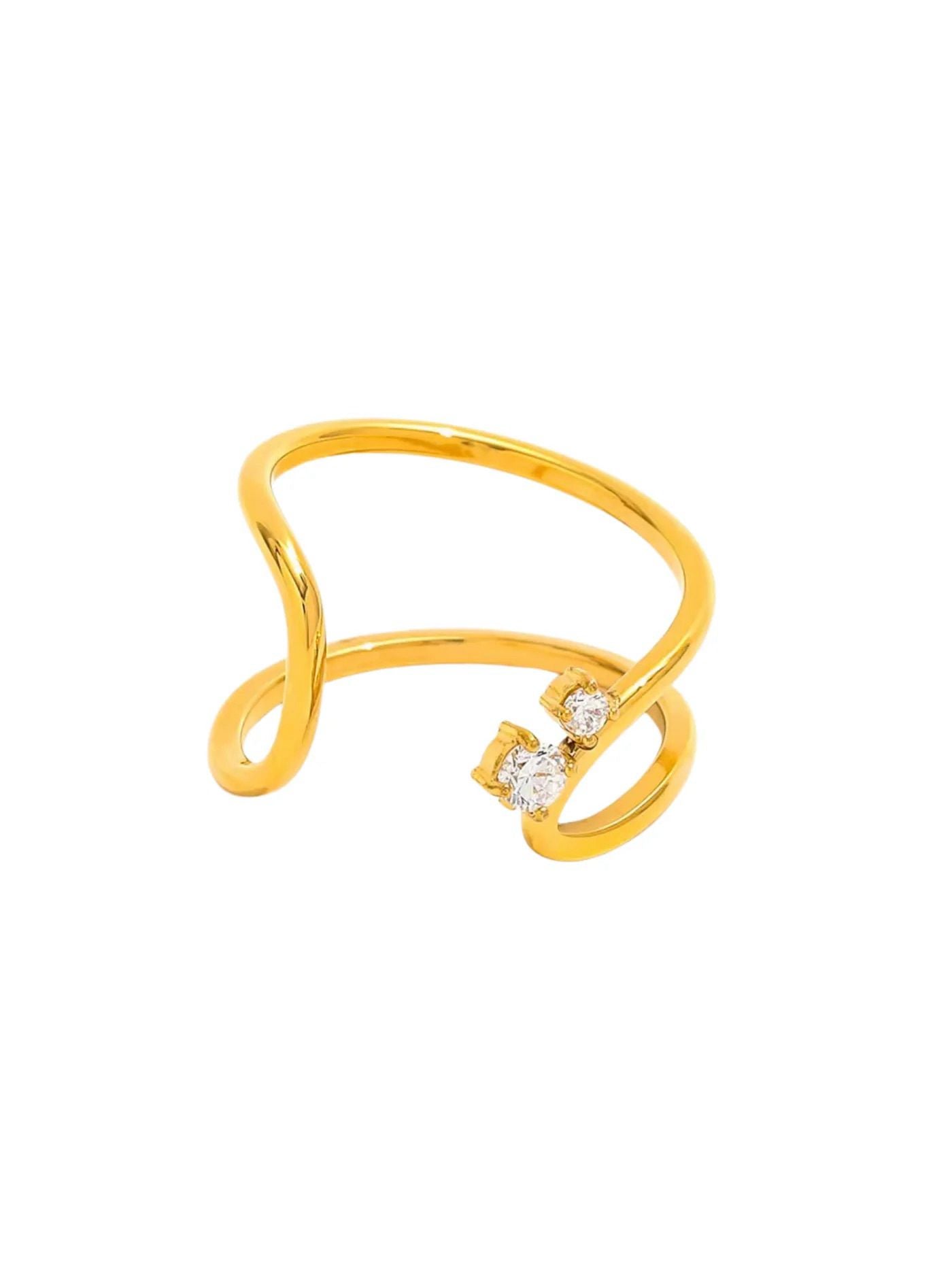 An 18K gold plated stainless steel terra rosa ring with a unique design and embellishments on a white background.